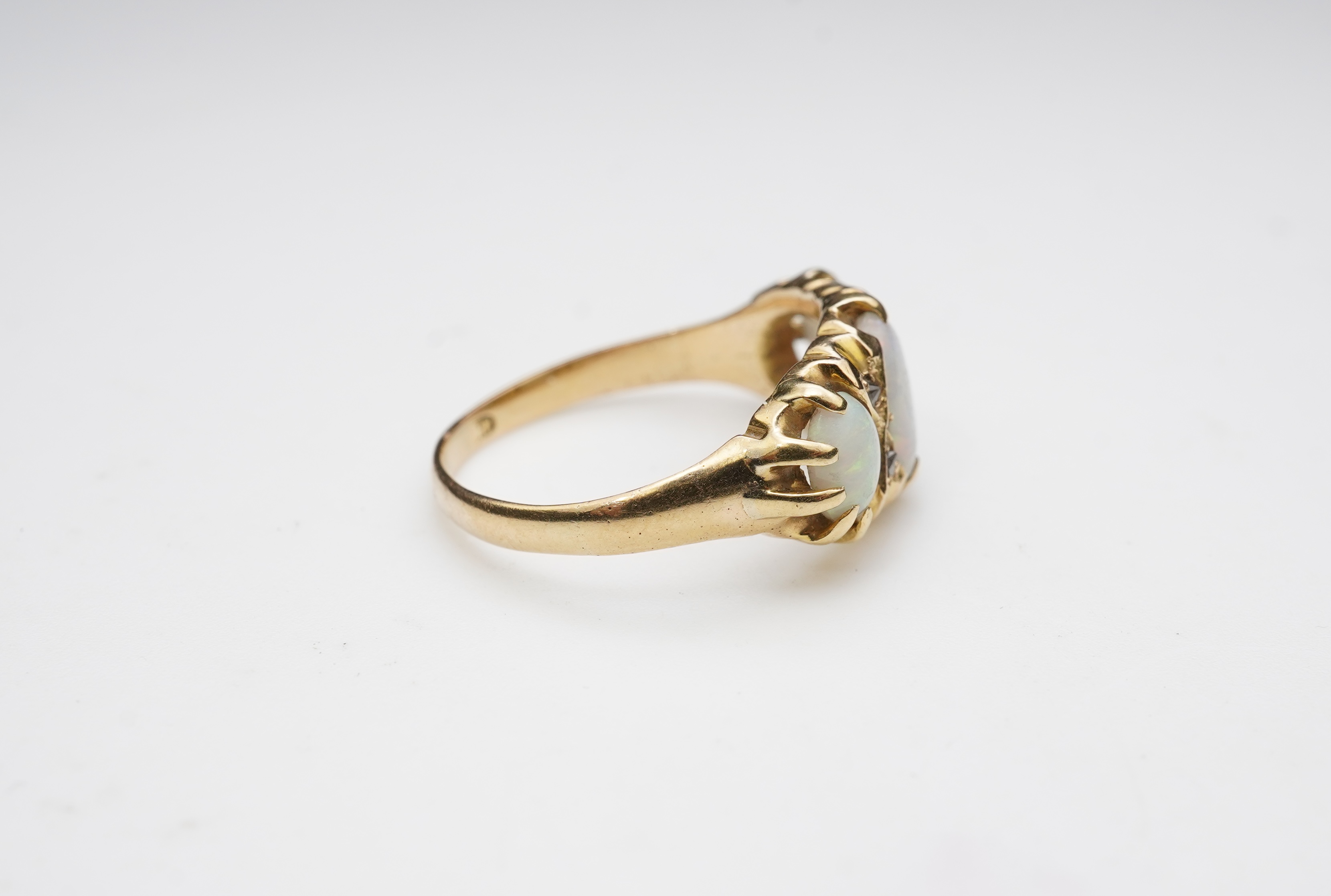 A Victorian 18ct gold and opal ring, circa 1898